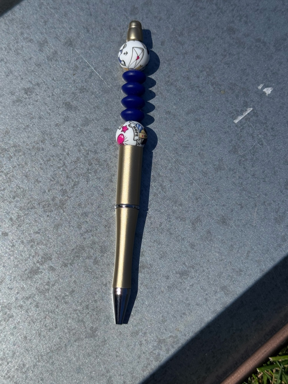 Gold Metal Pen with Blue Beaded Charm featuring 'Hope' Accent